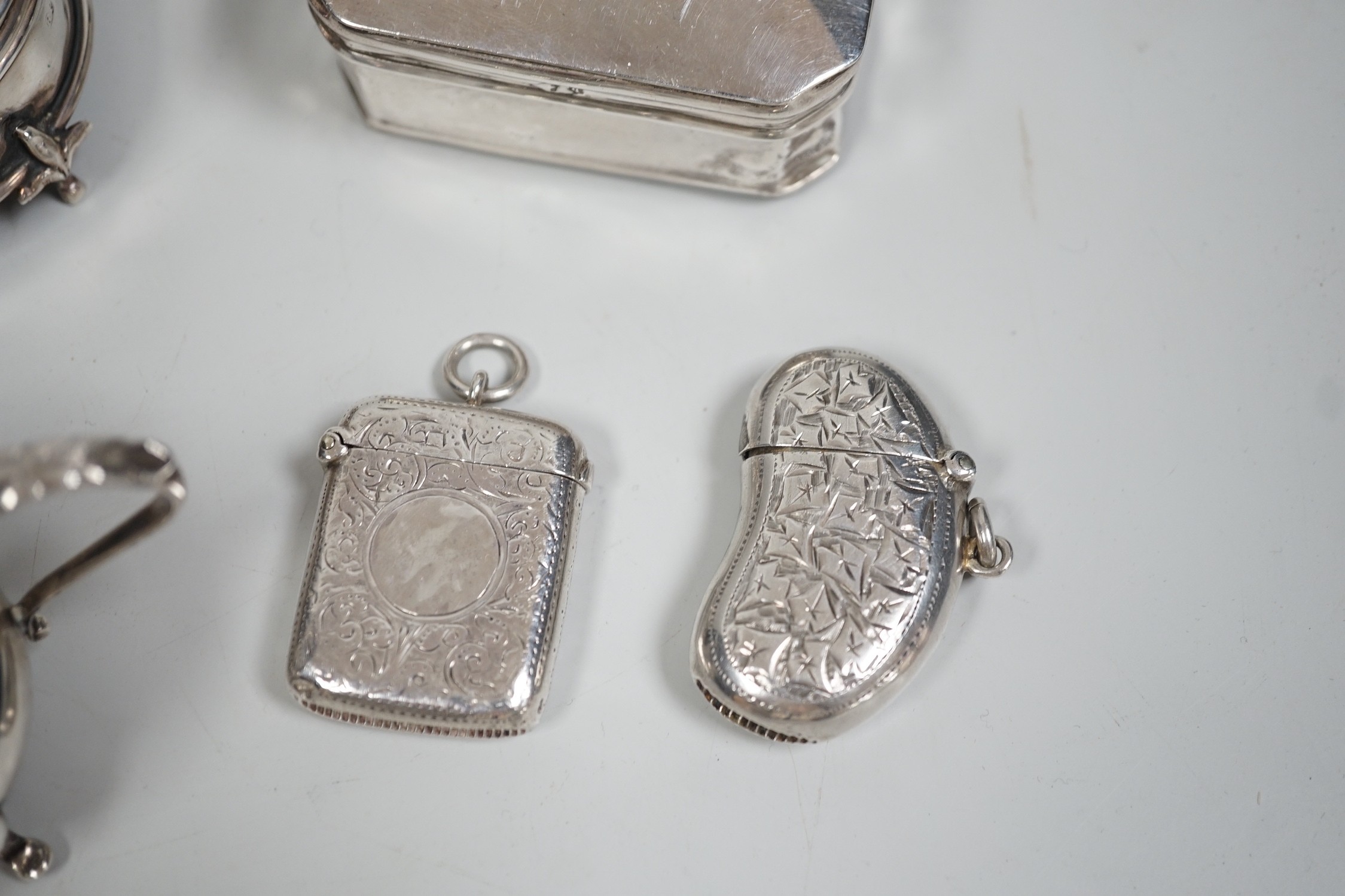 A collection of small silver items including two trinket boxes, a damaged mustard pot, two vesta case, snuff box etc. and a white metal box.